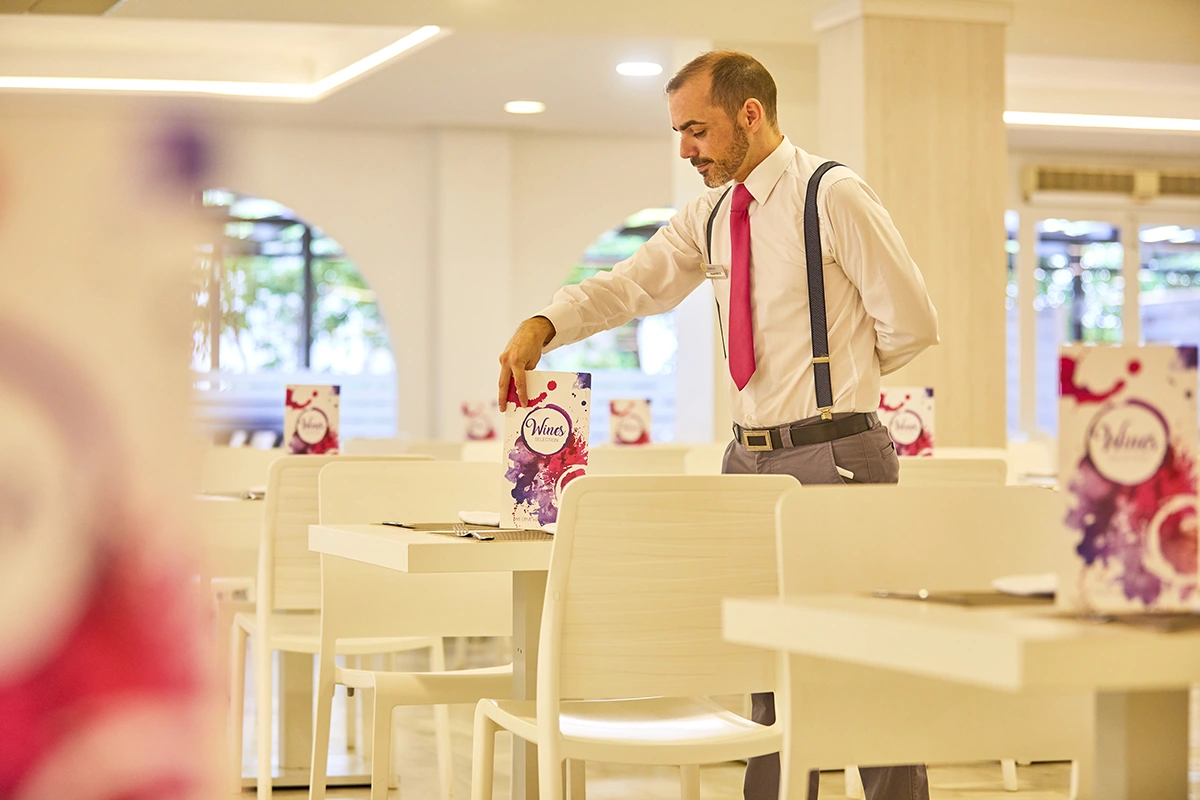 Buffet at S'Embat restaurant Waiter setting tables at S'Embat restaurant Fergus Style Bahamas by Fergus Hotels