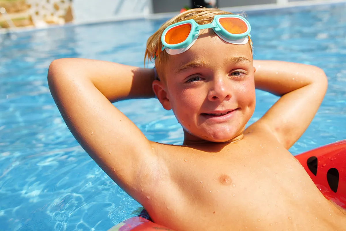First child free Child on an inflatable mattress in a pool at Fergus Hotels